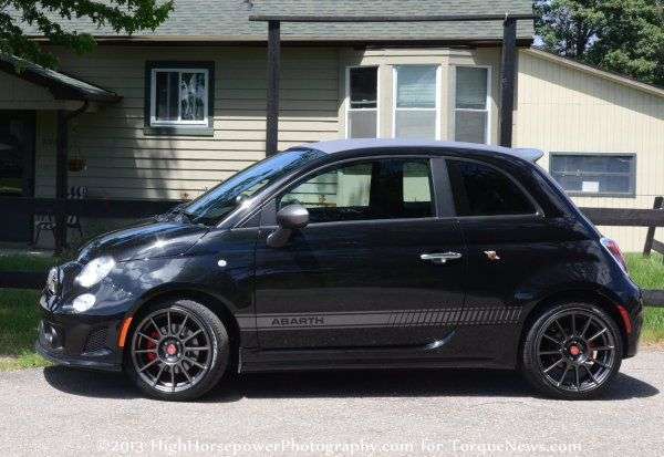 The side profile of the 2013 Fiat 500C Abarth with the top up
