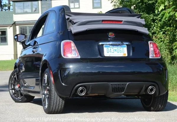 The rear end of the 2013 Fiat 500C Abarth with the top down