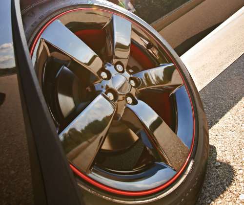 The wheel of the 2013 Dodge Challenger R/T Redline