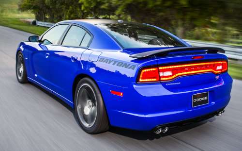 The rear end of the 2013 Dodge Charger Daytona with the tail lights lit