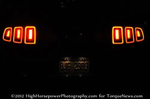 The 2013 Ford Mustang GT Premium Coupe from the rear in the dark