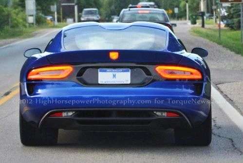The 2013 SRT Viper GTS in bright metallic blue with the taillights lit