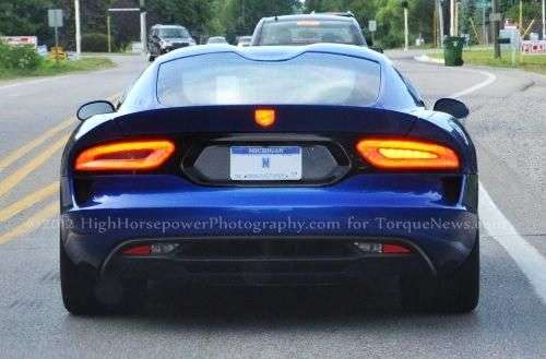 The 2013 SRT Viper GTS in bright metallic blue with the turn signal on