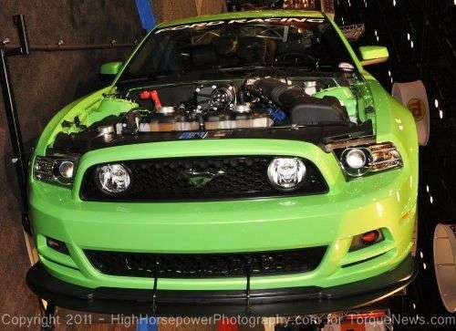 The 2013 Ford Mustang GT in Gotta Have It Green from the front