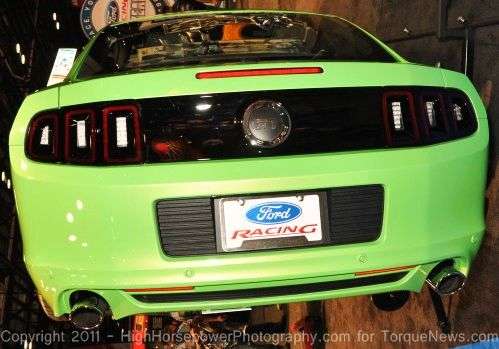 The 2013 Ford Mustang GT in Gotta Have It Green from the rear