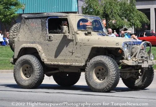 A mud coated Jeep Wrangler