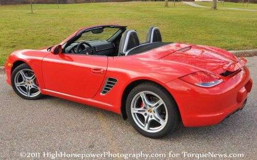 The 2012 Porsche Boxster S from the back with the top down