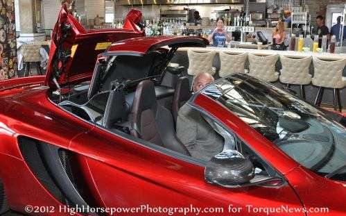 The 2013 McLaren 12C Spider with the top going up