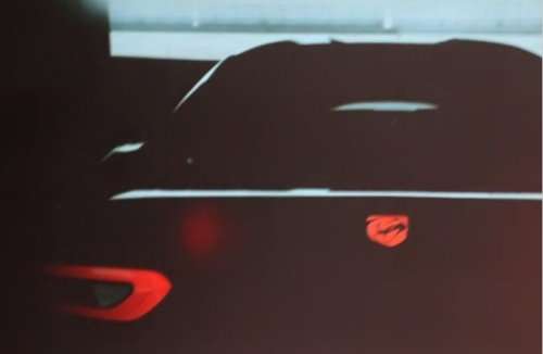 A shadowy rear shot of the 2013 SRT Viper in computer generated images