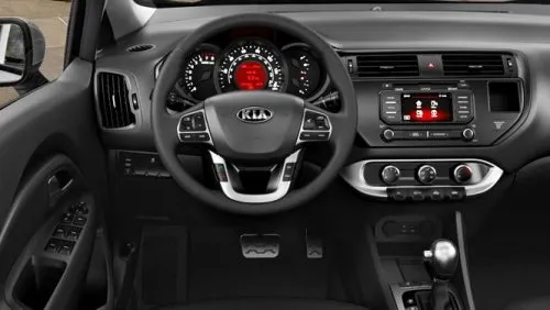 The dash and steering wheel of the 2012 Kia Rio SX 5-door