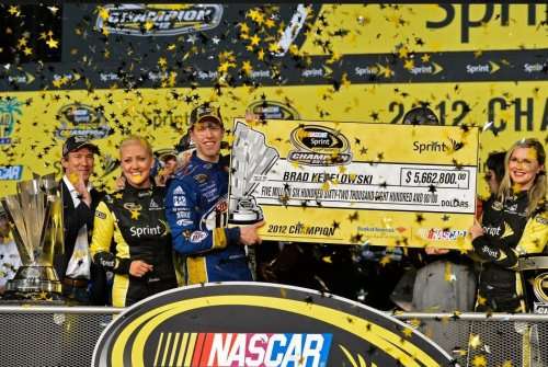 Brad Keselowski with the NASCAR championship check