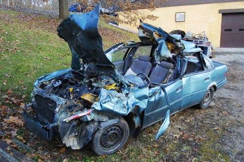 A wrecked Ford Tempo
