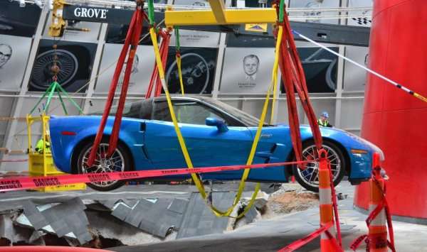 The 2009 Corvette ZR1 Blue Devil being lifted out of the sinkhole