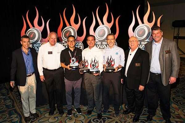 The 2013 SEMA Awards being handed to company reps.