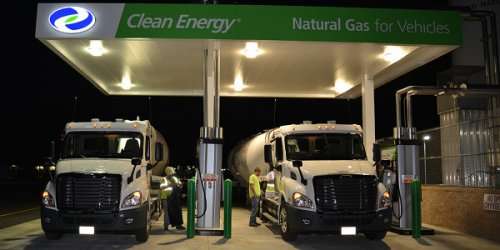 Two new Freightliner Cascadia day cabs at an NG filling station