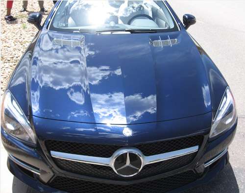 Clouds reflected in the hood of the 2013 Mercedes-Benz SL 550c