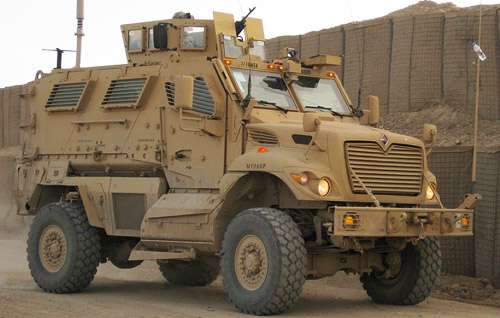  Shows the MRAP Driving. High-resolution image of the MaxxPro Dash model.