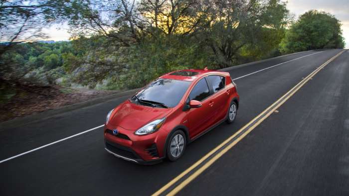2018 Toyota Prius C driving down the highway, loving life and freedom