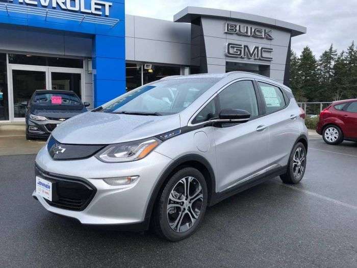 Chevy Bolt in front of Chevrolet Dealership 1200x900