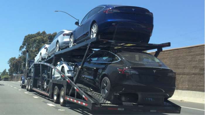 Tesla Model 3 car carrier trailer makes its way on the Hollywood Freeway loaded with Model 3’s for delivery.