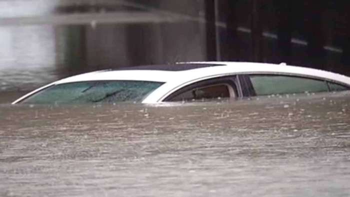 Vehicle Submerged By Rains Following Hurricane