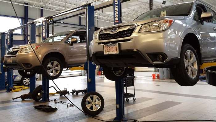Image of Subaru Foresters being serviced by John Goreham