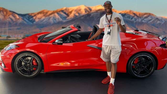 Clarence Garner witht the 2020 red Chevrolet Corvette C8