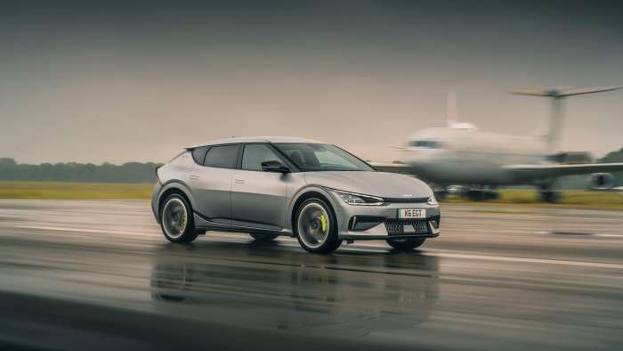 Image of a Kia EV6 GT being driven at speed on a runway.