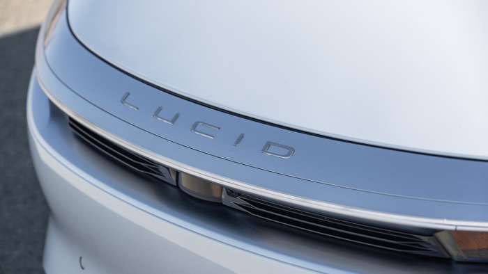 Image showing the hood, headlights and cameras in the nose of a white Lucid Air.