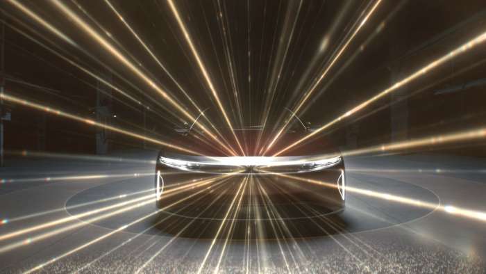 Image showing the front of a Lucid Air with beams emanating from its central Lidar unit.