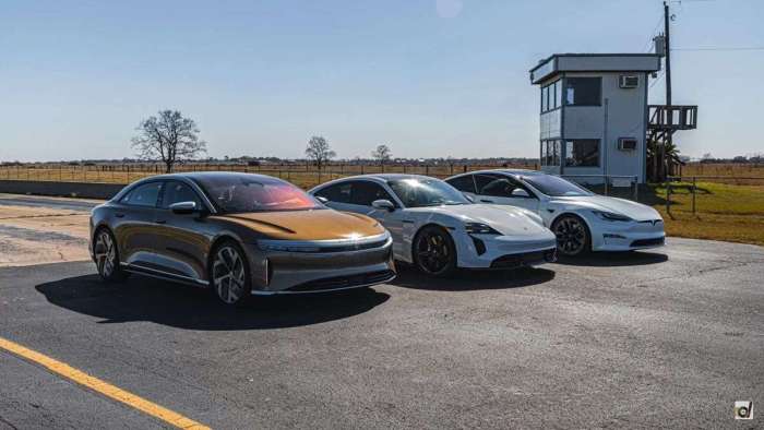 Image showing a gold Lucid Air parked beside a white Porsche Taycan Turbo S and Tesla Model S Plaid as they prepare for a three-wide drag race.