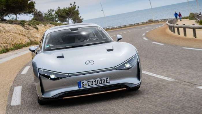 Image showing the Mercedes Vision EQXX driving on a twisting coast road.