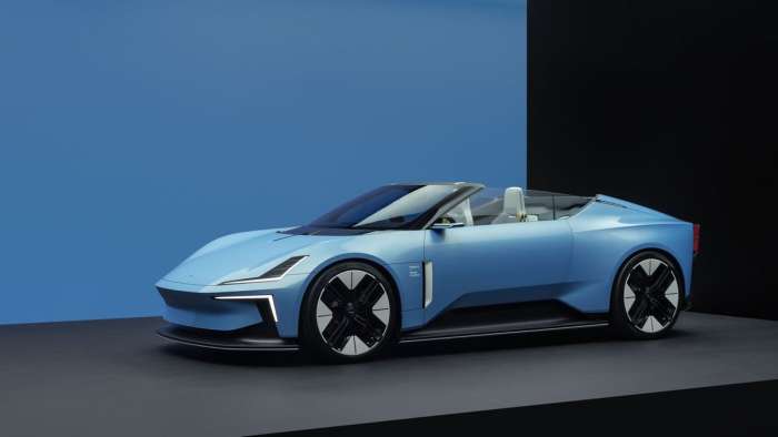 Image showing the Polestar 6 in blue with its roof down.