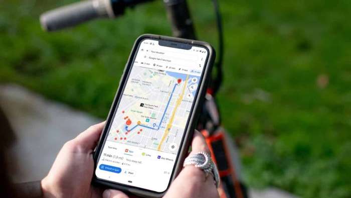 Spin User Examines Google Maps Display Of Route And Vehicles