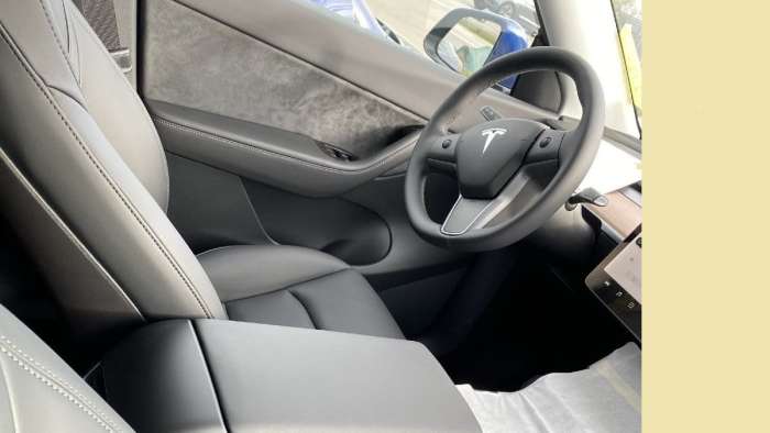 Tesla Model Y Interior shows the driver side