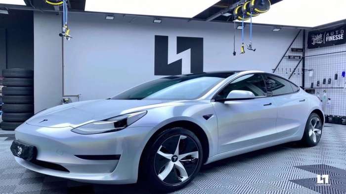 A Tesla with a white wrap