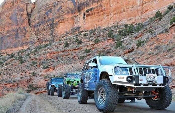 Three Jeep Wranglers On The Road