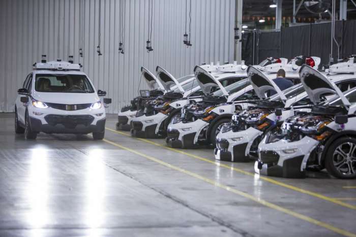 Chevrolet Bolt EV autonomous vehicles wait to be tested.