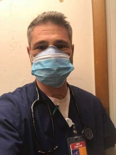 Dr. in surgical masks by Justin Garnick