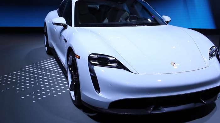 White Porsche Taycan EV competes well with Tesla Model S