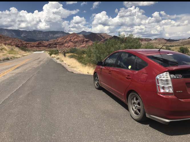 red toyota prius out in nature