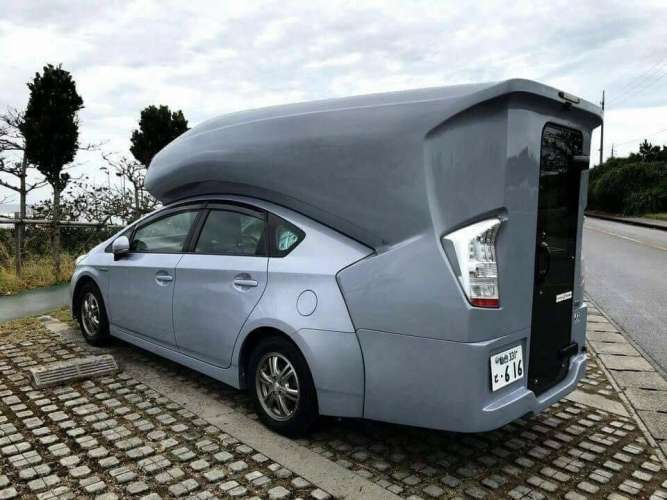 Toyota Prius with camper over car
