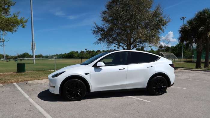 Tesla Model Y side view, white color