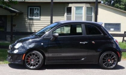 The side profile of the 2013 Fiat 500C Abarth with the top up