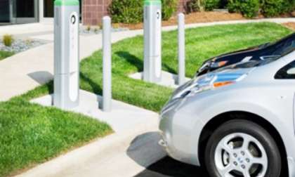 Electric fleet vehicles charge at commercial Plugless Power wireless charging st