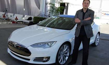 Elon Musk in front of Tesla Model S