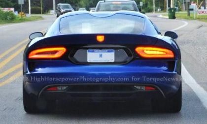The 2013 SRT Viper GTS in bright metallic blue with the turn signal on