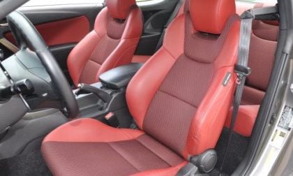 The bright red leath seats of the 2013 Hyundai Genesis Coupe 3.8 R-Spec