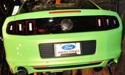 The 2013 Ford Mustang GT in Gotta Have It Green from the rear