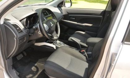 The front interior of the 2012 Mitsubishi Outlander Sport SE AWC